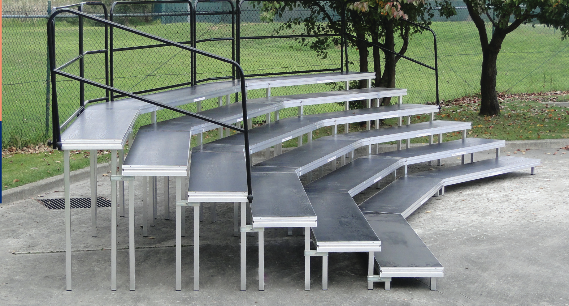 Pilot choir risers — curved, multi-tier with handrails